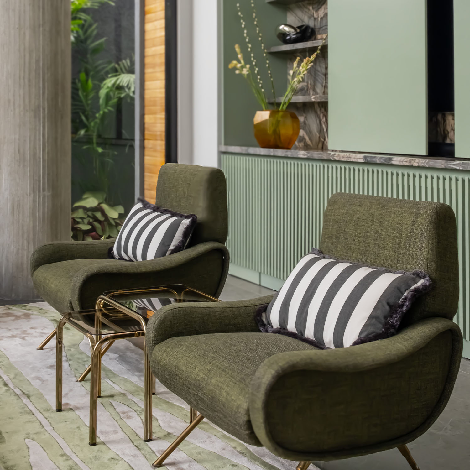 A corner featuring two green armchairs