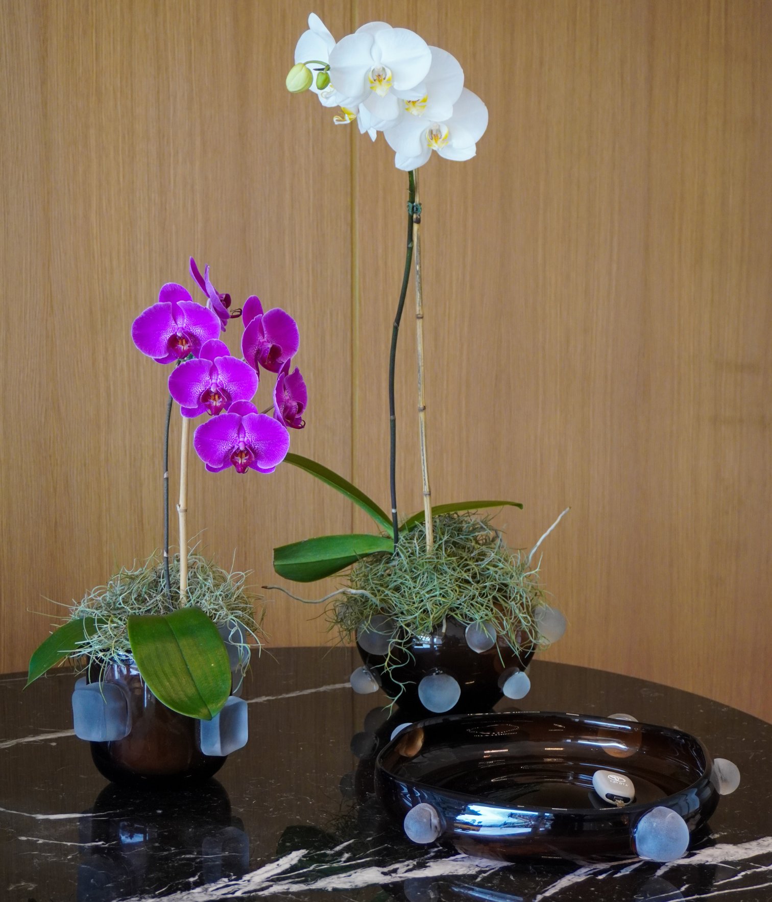 Orchid floral arrangement used as decorative styling in a modern residential interior design project.