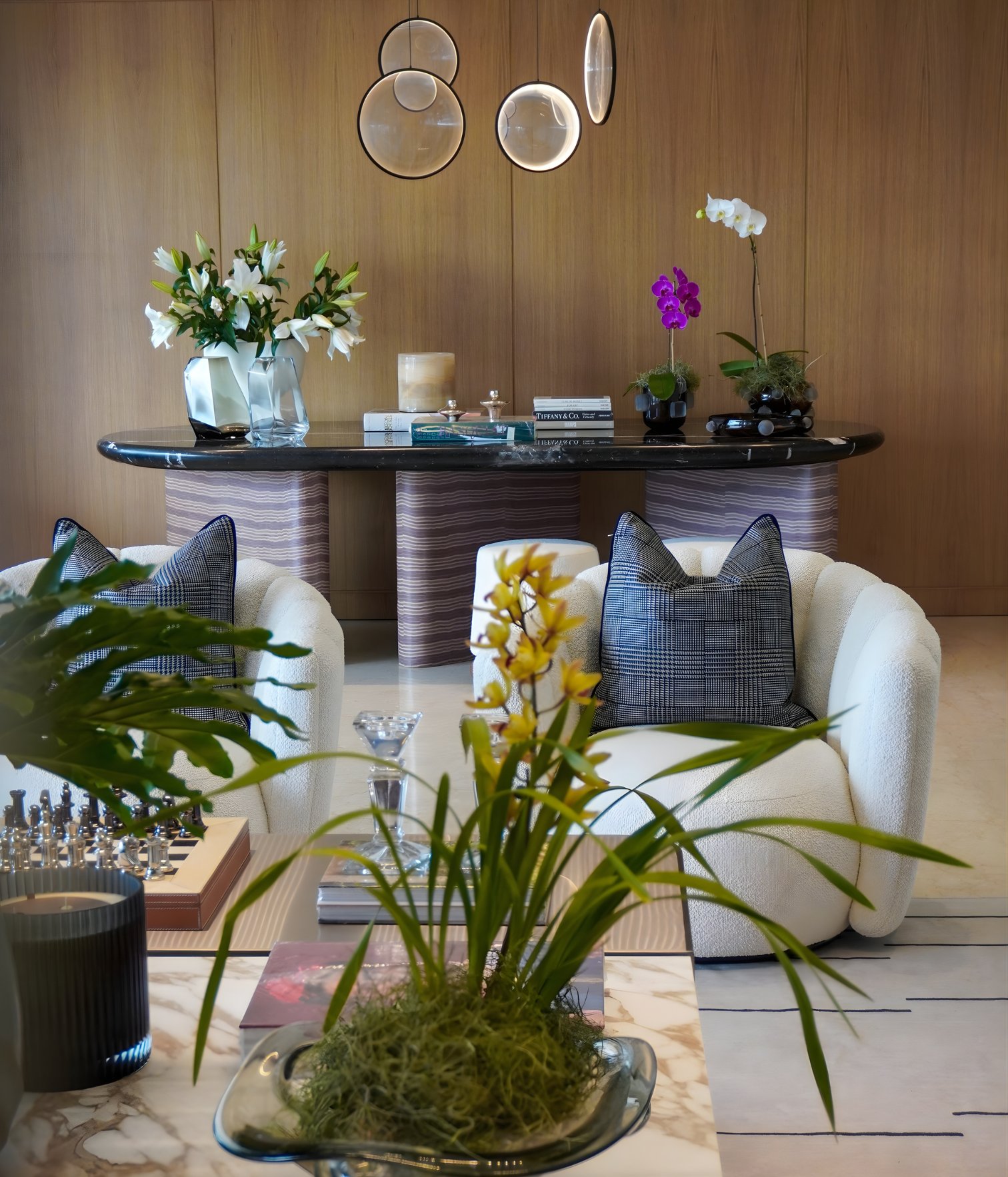 contemporary console table with marble top and decorative objects in a luxury residential interior.